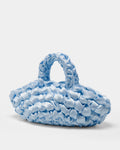 The Quintessential Bridal Bag. Introducing the Nest. Every ISLA DE GAR bag begins with a ribbon, a crochet hook, and a pattern - but that's where the similarities end. This unique design weaves together two lengths of satin, creating a beautifully tactile, sculptural croissant bag that's irresistibly plush and impossible to ignore.